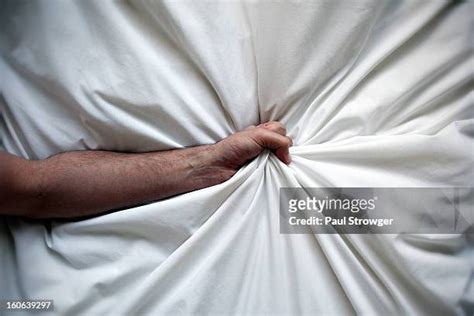 Hand Grabbing Sheets Photos And Premium High Res Pictures Getty Images