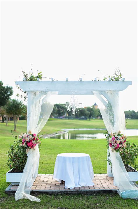 Bright White Fabric Draped Wedding Arch