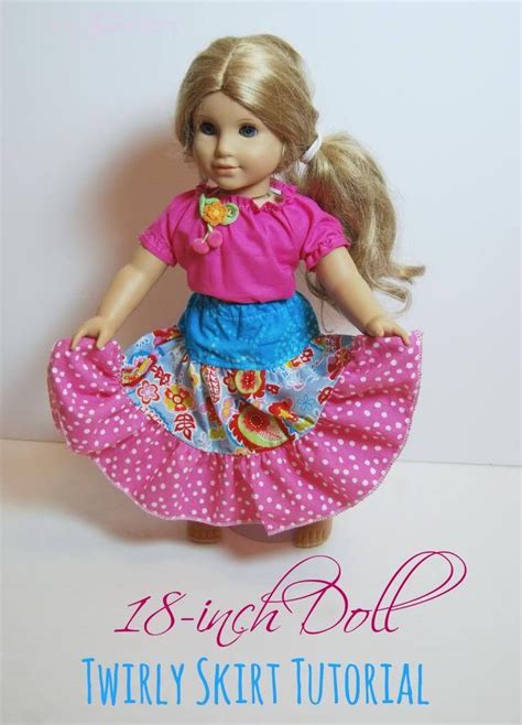 a doll with blonde hair wearing a pink top and blue polka dot skirt is standing on a white surface