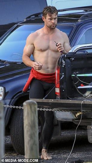 Byron Babe Chris Hemsworth Flaunts His Bulging Muscles As He Strips Off His Wetsuit After