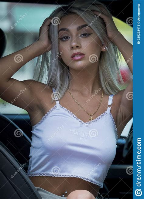 a lovely blonde model poses outdoors in a large city environment stock image image of blonde