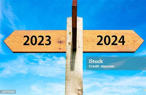 Arrow Signs With Years 2023 And 2024 New Year Concept Stock Photo