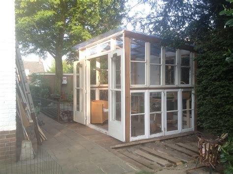 Recycled Greenhouse Made Of Old Windows And Wood Backyard Greenhouse