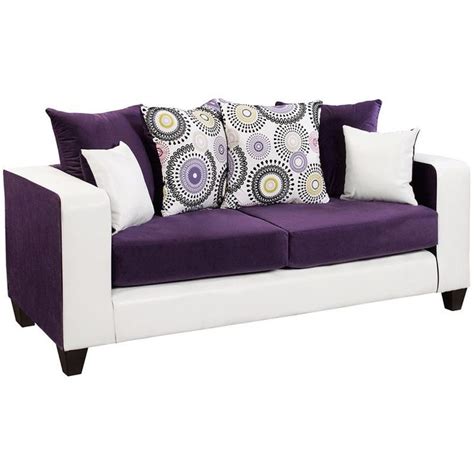 A Purple And White Couch With Two Pillows On Its Back Against A White