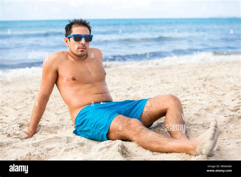 Handsome Man Relaxing On The Beach Stock Photo Alamy