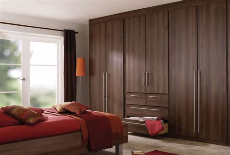 Even bedrooms with little kids are still kept organized by having enough storage areas to keep all the toys and other stuffs. Dark brown bedroom furniture with red accessories ...