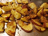 Oven-roasted red potatoes with olive oil and various herbs and spices ...