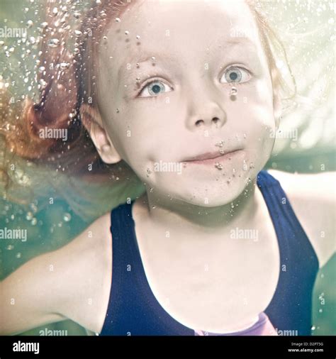Caucasian Girl Swimming Under Water Stock Photo Alamy