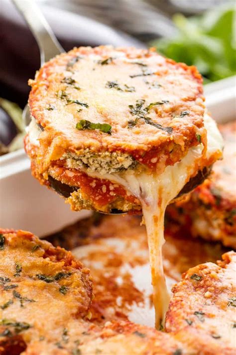 delicious baked eggplant parmesan with crispy coated eggplant slices smothered in cheese and
