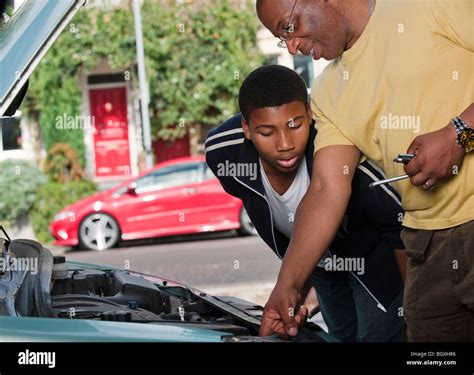 Father And Son Working On Car Engine Stock Photo Alamy