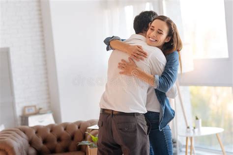 Excited Loving Wife Hugging Her Kind Supporting Husband Stock Image