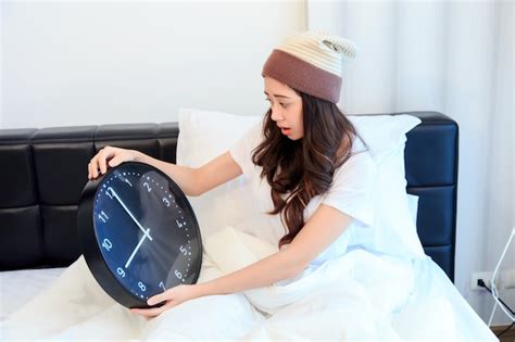 Premium Photo Shocked Young Woman Waking Up With Alarm On Her Bedroom