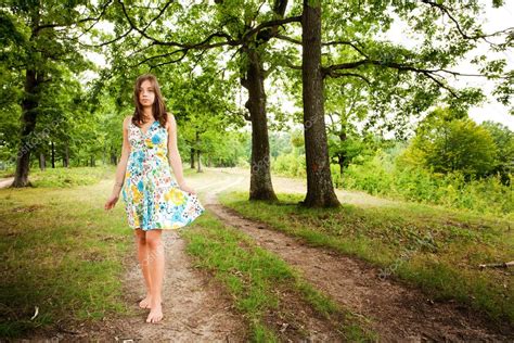 Barefoot Woman Walking In The Forest Stock Photo By ©xalanx 2210699