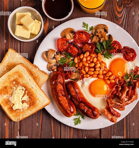 Traditional Full English Breakfast With Fried Eggs Sausages Beans