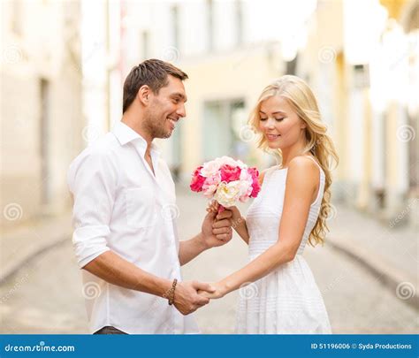 Couple With Flowers In The City Stock Photo Image Of Engagement