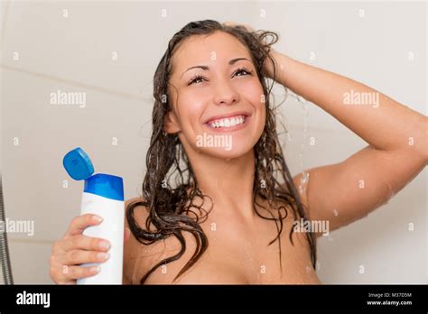 Beautiful Smiling Young Woman Washing Her Long Hair With Shampoo Stock