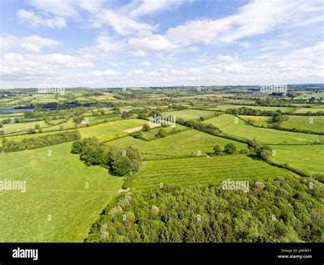 Aerial View Of Rural English Countryside Of Green Farm Fields