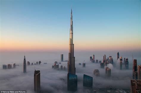 Rising About The Clouds The Worlds Tallest Building Peaks Above The