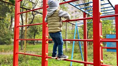 Little Boy Kid Climbing Ladder At Modern Playgroundchildren Sport