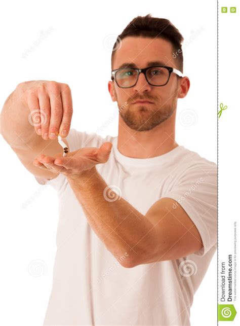 Man Breaking Cigarette As A Gesture Of Quitting Smoking Stock Photo