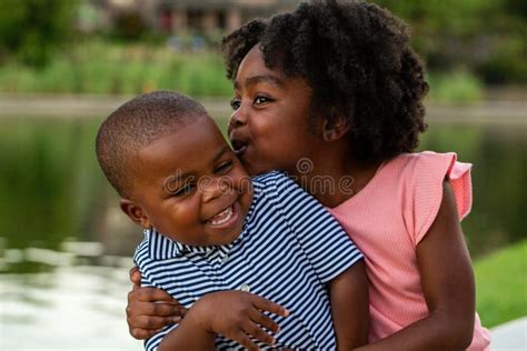 African American Brother And Sister Laughing And Smiling Stock Photo