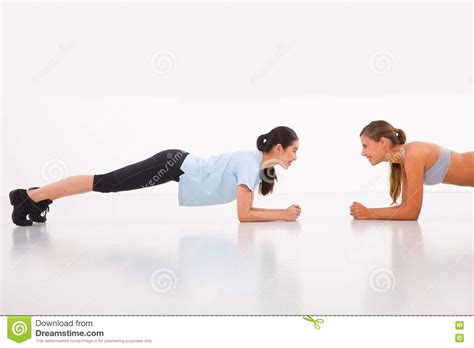 Two Happy Young Woman Doing Push Ups In Gym Stock Image Image Of
