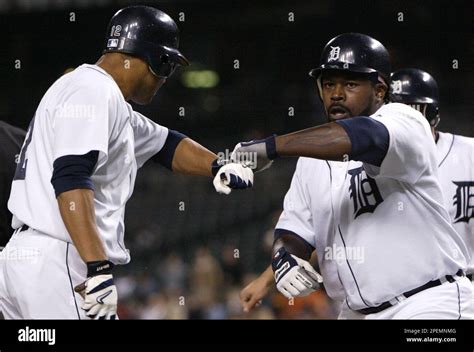 Detroit Tigers Dmitri Young Right Is Congratulated By Carlos Pena