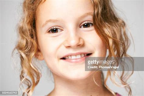 Girl With Curly Blonde Hair Photos And Premium High Res Pictures