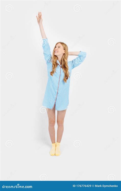 Beautiful Brooding Girl In Pajamas Holding A Pillow In Her Hands
