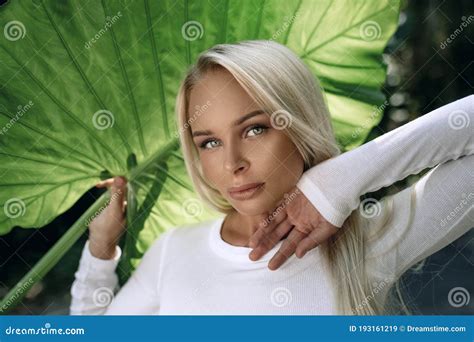 Sensual Slim Blonde Spends Time On A Tropical Island Stock Image