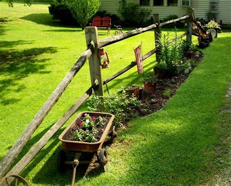 Check the bottom of my post for links to all kinds of fun outdoor ideas from. the split rail fence along my driveway. junk and flowers ...