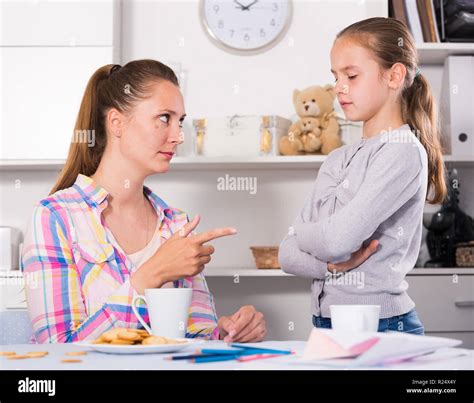 Young Mother Scolding Her Daughter For Bad Behavior And Mistakes Stock
