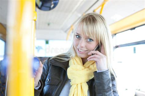 Young Blond Woman With A Smart Phone Inside A Bus Stock Image Image