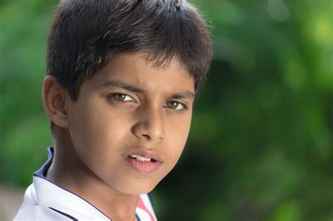 Premium Photo Handsome Kid Looking Into Camera Close Up Emotions Of A