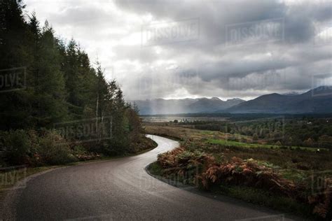 Winding Road Through Mountains Scotland Uk Stock Photo Dissolve