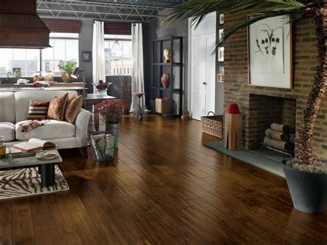 Striking dark oak hardwood boards run all along the floor surface of this luxury master bedroom with dark oak flooring and ocean views. Hardwood Floors | HGTV