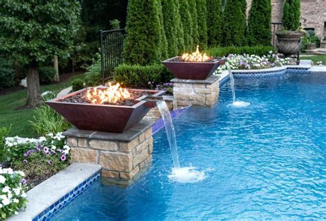 Custom designed swimming pool with elevated spa and fire bowl features. fire bowls for pool - Google Search | Fire feature pool ...