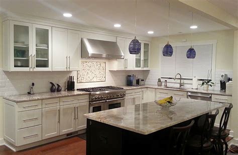 Average cost to paint kitchen cabinets the average cost to paint kitchen cabinets ranges from $900 to $3,800. Photo gallery of remodeled kitchen features CliqStudios Rockford Painted Whi… | Contemporary ...
