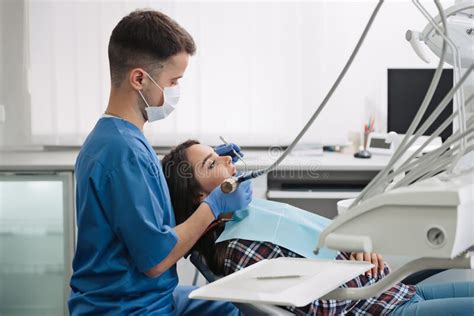 Dentist Treats Teeth Of Patient Stock Image Image Of Clinic Office