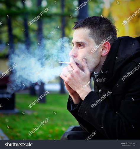 Sad Nervous Young Man Smoking Cigarette Stock Photo 236102386