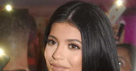 kylie jenner shows major cleavage in racy black dress almost has wardrobe malfunction—see the