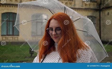 Fat Ginger Girl With Glasses Is Walking In Park In Rainy Weather