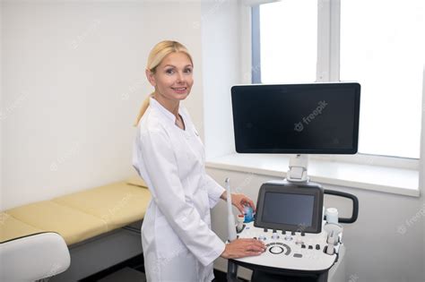 Premium Photo Blond Pretty Ultrasound Specialist In White Robe