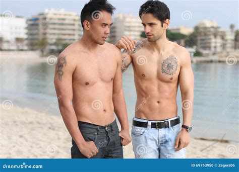Two Handsome Men Posing On The Beach Stock Photo Image Of Summer