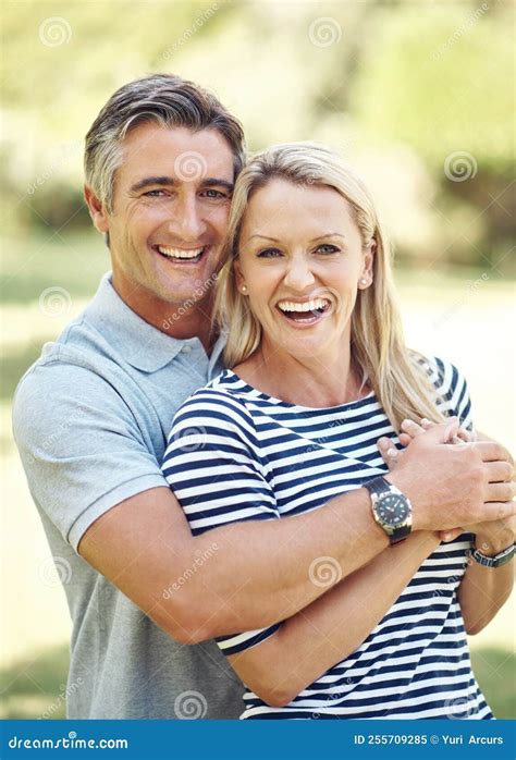 Keeping Her Close Cropped Portrait Of An Affectionate Mature Couple Enjoying A Day In The Park