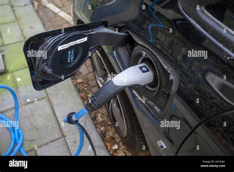 Electric Vehicle Plugged Into Charging Port The Hague The Netherlands