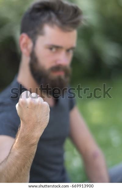 Bearded Guy Making Clenched Fist Camera Stock Photo 669913900