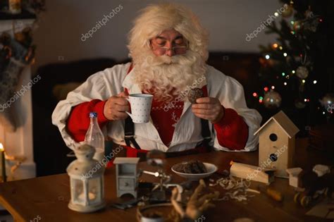 Santa Claus Eating Cookies With Milk — Stock Photo © Hasloo 90071376