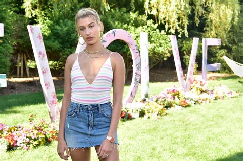 hailey baldwin talks summer style at revolve pool party teen vogue