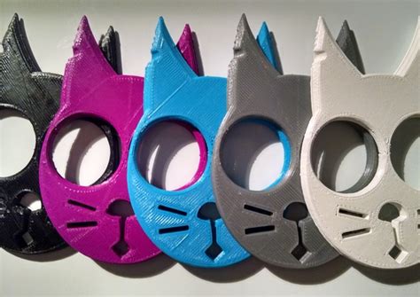 All you need to do is slipping two fingers through the 'eyes' of the cat the sharp ears of the cat self defense keychain will do the remaining damage and cause tremendous pain to the attacker. Cat Face Keychain Self Defense Device Feline Toy | makexyz.com